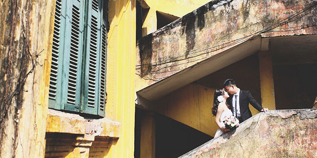 bride and groom on old building stair